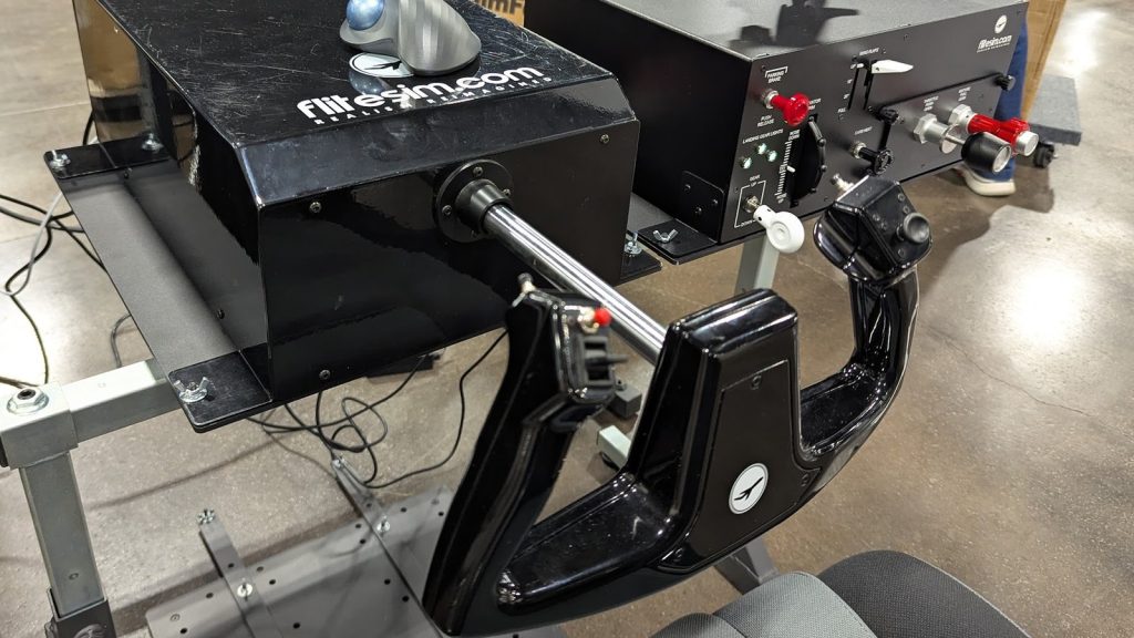 FliteSim CLS-60 force feedback yoke on its mount, with the FliteSim throttle quadrant behind it